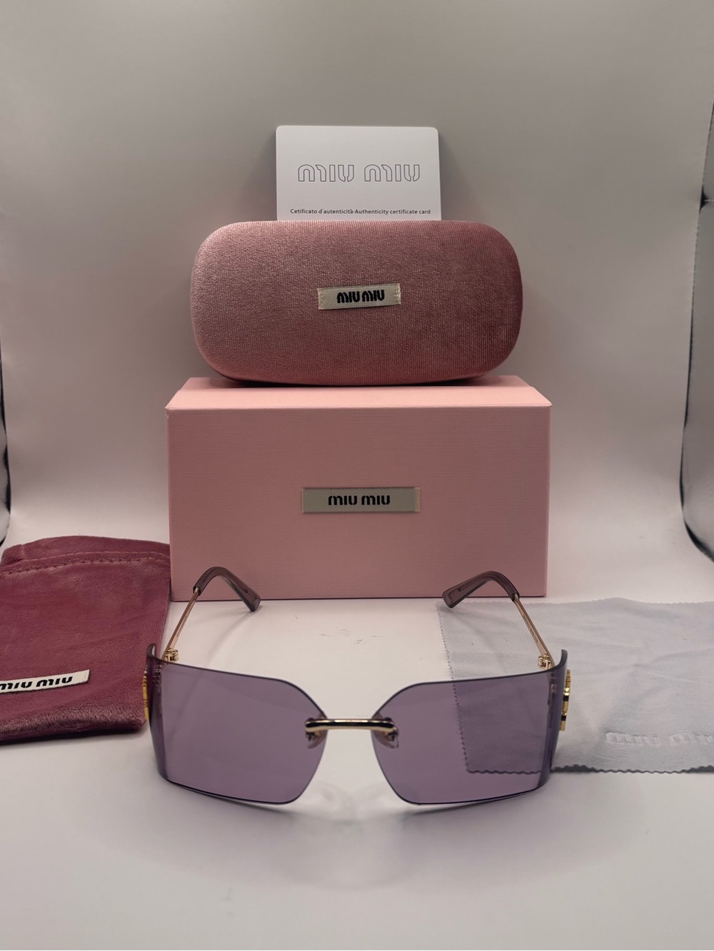 Miu Miu Purple Rimless Sunglasses